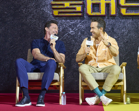 Actors Hugh Jackman, left, and Ryan Reynolds speak at a press conference for the upcoming Marvel superhero action movie ″Deadpool & Wolverine″ at the Four Seasons Hotel Seoul in Jongno District, central Seoul, on July 4. [WALT DISNEY COMPANY KOREA]