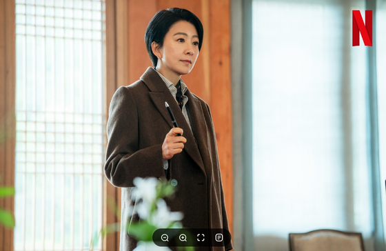 Actor Kim Hee-ae plays Deputy Prime Minister for Economic Affairs Jeong Su-jin in the Netflix drama ″The Whirdwind.″ [NETFLIX]