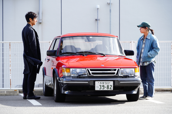 A scene from "Drive My Car," which centers around theater director Kafuku (played by actor Hidetoshi Nishijima), left, and his driver Watari (played by actor Toko Miura). [BIFF]
