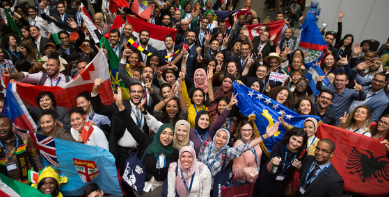 Scholars who received the U.K. government's Chevening Scholarship pose for a photo with their country's flags [BRITISH EMBASSY SEOUL]