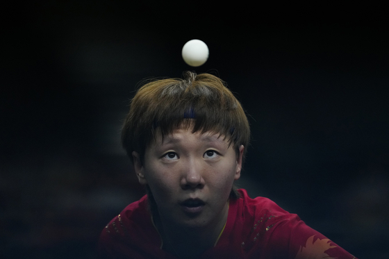 China's Wang Manyu plays against Japan's Miwa Harimoto during the women's gold medal team table tennis match at the 2024 Paris Olympics on Saturday in Paris, France. [AP/YONHAP]