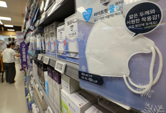 Boxes of disposable face masks are displayed at a discount mart in Seoul on Monday. [YONHAP]