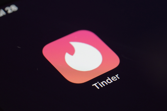 The icon for dating app Tinder as seen on a device on July 28, 2020, in New York. [AP/YONHAP]