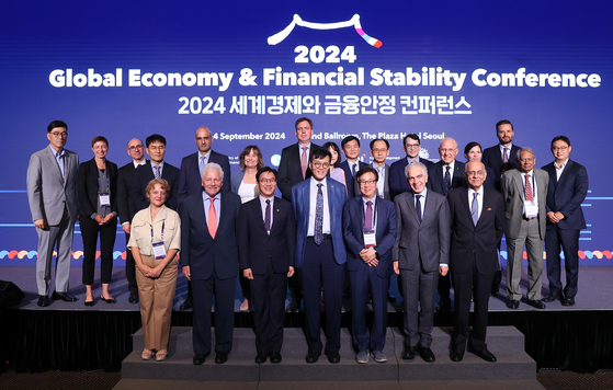 Bank of Korea (BOK) Gov. Rhee Chang-yong, center in the front row, poses for a photo with attendees of the 2024 Global Economy & Financial Stability Conference held in central Seoul on Tuesday. [BOK]