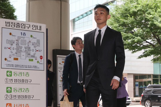 Actor Yoo Ah-in attends his final trial for drug charges at the Seoul Central District Court in southern Seoul on July 24.[YONHAP]