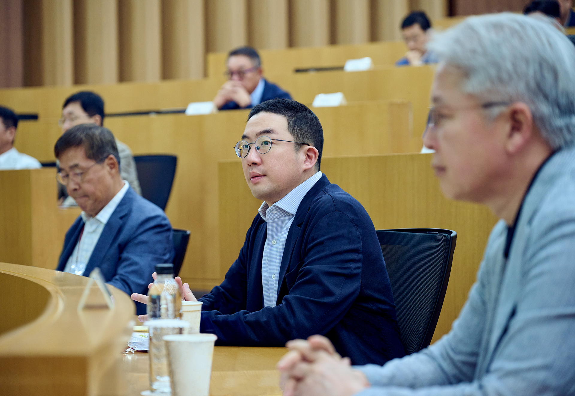 LG Group Chairman Koo Kwang-mo, center, sits with other executives during a workshop in Icheon. [LG GROUP]
