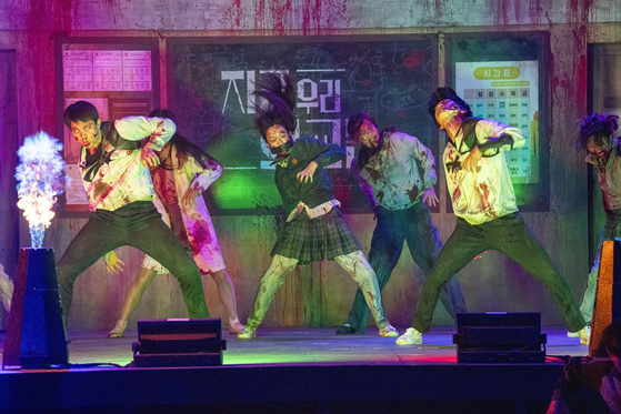 Actors stage a zombie musical show for 15 minutes every evening at at the "All of Us Are Dead" zone, part of Everland's Blood City. [SAMSUNG C&T]