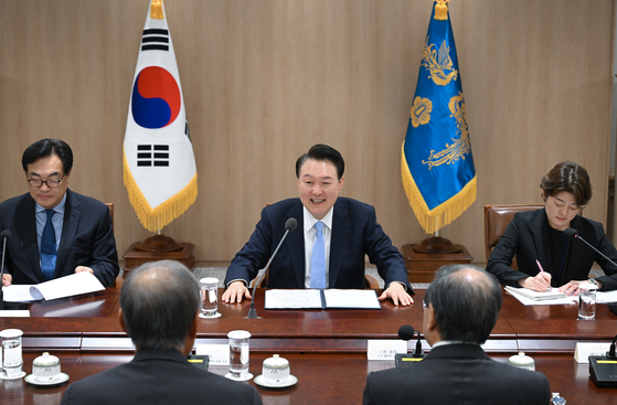 President Yoon Suk Yeol, center, speaks during a meeting with the Japanese business delegation at the presidential office in Yongsan District, central Seoul, on Friday. [PRESIDENTIAL OFFICE]