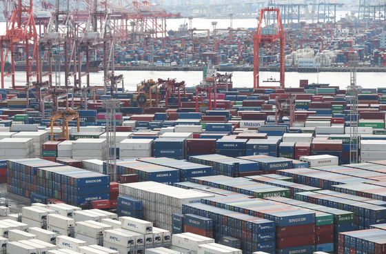 Shipping containers are stacked at a port in the southeastern city of Busan in September. [NEWS1]
