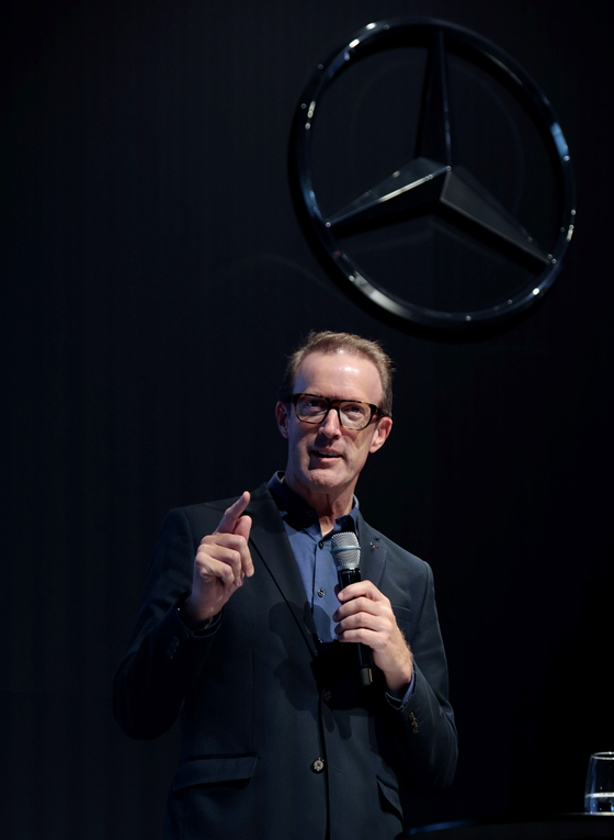 Rob Halloway, head of global communications at Mercedes-Benz Cars & Vans, explains the carmaker's first battery recycling plant in Kuppenheim in southern Germany on Tuesday. [SARAH CHEA]