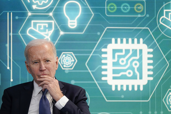 President Joe Biden attends an event to support legislation that would encourage domestic manufacturing and strengthen supply chains for computer chips in the South Court Auditorium on the White House campus, March 9, 2022, in Washington. [AP]