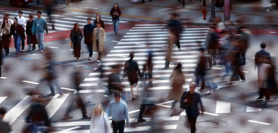 Pedestrians walk on a crossroad in Jongno District, central Seoul, on Wednesday. [NEWS1]