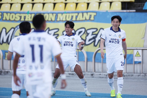 Chungnam Asan FC's Lee Hak-min, center, celebrates during the K League 2 match against Seongnam FC at Tancheon Sports Complex Main Stadium in Seongnam, Gyeonggi in a photo shared on Asan's Facebook account on Sunday. [SCREEN CAPTURE]