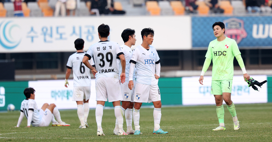 Busan IPark react after losing the 2023 K League promotion-relegation playoffs against Suwon FC at Suwon Sports Complex in Suwon, Gyeonggi on Dec. 9, 2023. [NEWS1] 