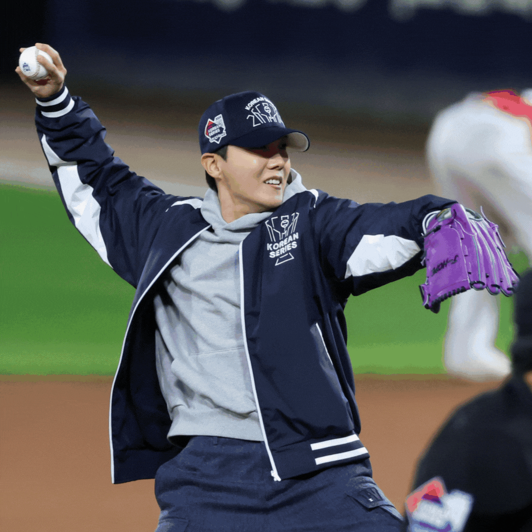 BTS member J-Hope throws out the ceremonial first pitch before Game 2 of the Korean Series between the Kia Tigers and Samsung Lions at Gwangju-Kia Champions Field in Gwangju. [YONHAP]