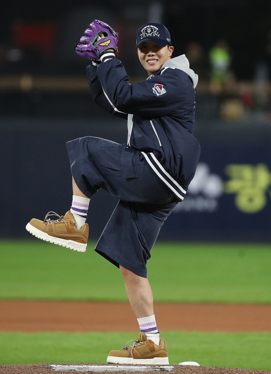 BTS member J-Hope throws out the ceremonial first pitch before Game 2 of the Korean Series between the Kia Tigers and Samsung Lions at Gwangju-Kia Champions Field in Gwangju. [NEWS1]
