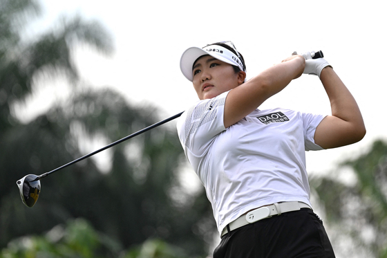 Ryu Hae-ran watches her shot after teeing off on the second hole during the Maybank Championship at the Kuala Lumpur Golf and Country Club in Kuala Lumpur, Malaysia, on Saturday. [AFP/YONHAP] 
