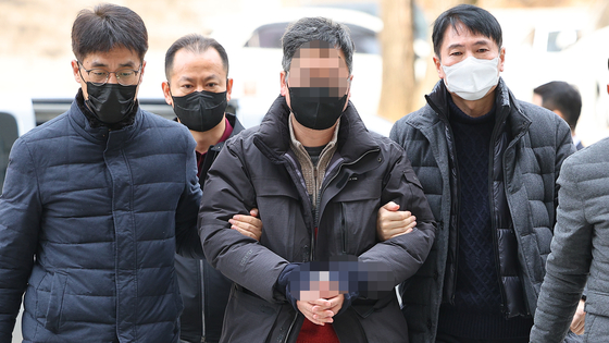  A civic activist suspected of spying for North Korea arrives at the Seoul Central District Court in southern Seoul to attend his arrest warrant hearing on Jan. 31, 2023. [YONHAP]