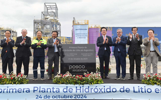 Posco Group associates and Argentinian officials pose for a photo at a ceremony held to mark the completion of POSCO Holdings' lithium hydroxide plant in Güemes City, Salta Province of Argentina, on Oct. 24. [POSCO HOLDINGS]