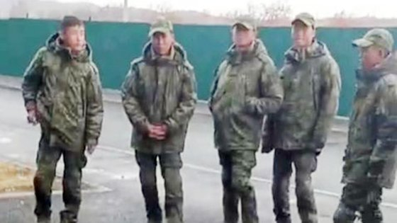 Soldiers believed to be from North Korea are standing outside a building at a military base in Sergievsky in Russia's Far Eastern city of Vladivostok in video footage captured by Astra, an outlet claiming to be independent Russian media, on Oct. 22. [SCREEN CAPTURE]