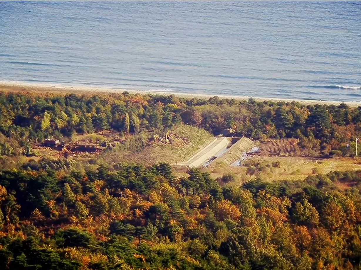 A photograph released by South Korea's Joint Chiefs of Staff on Monday shows a concrete-lined trench constructed by North Korea on the site of the now-destroyed road along the Donghae Line connecting the two Koreas's eastern coast. Pyongyang also constructed a rammed earth fortication to the north of the trench, which can be seen on the left in this photograph. [JOINT CHIEFS OF STAFF]
