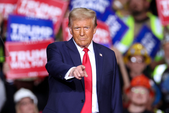 Former U.S. President and Republican presidential candidate Donald Trump gestures during a campaign rally at PPG Paints Arena in Pittsburgh, Pennsylvania on Nov. 4, 2024. [AFP/YONHAP]
