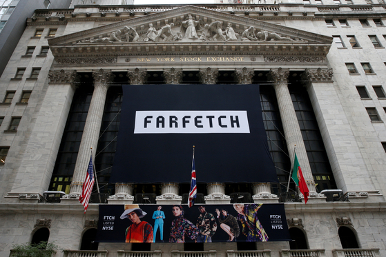 A banner to celebrate the IPO of online fashion house Farfetch is displayed on the facade of the of the New York Stock Exchange (NYSE) in New York on Sept. 21, 2018. [REUTERS]