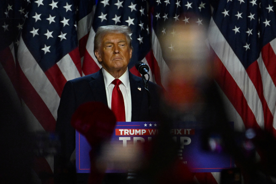 U.S. President-elect Donald Trump takes the stage following early results from the 2024 presidential election in Palm Beach County Convention Center in West Palm Beach, Florida, on Wednesday. [REUTERS/YONHAP]