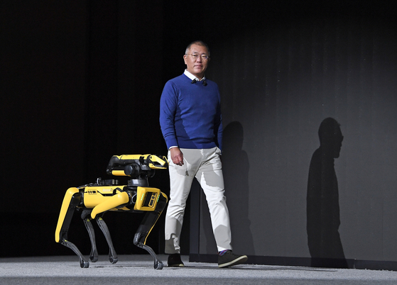 Hyundai Motor Group Euisun Chung walks with a Spot robot dog on the stage of CES 2022 in Las Vegas. [HYUNDAI MOTOR]