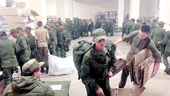 A screen capture shows soldiers, believed to be North Koreans, receiving basic supplies at a Russian training base in a video provided by the Ukrainian Center for Strategic Communication and Information Security, also known as Spravdi. [SCREEN CAPTURE]