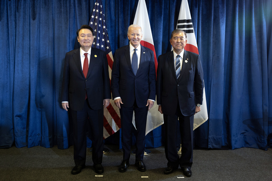 South Korean President Yoon Suk Yeol, left, U.S. President Joe Biden, center, and Japanese Prime Minister Shigeru Ishiba pose for a photo before holding a trilateral summit at the Lima Convention Center in Lima, Peru, on Nov. 15, as they met on the margins of the Asia-Pacific Economic Cooperation (APEC) summit. [PRESIDENTIAL OFFICE]