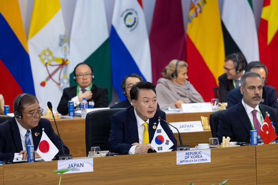 President Yoon Suk Yeol, center, speaks at a session of the G20 summit in Rio de Janeiro, Brazil, on Monday. [JOINT PRESS CORPS]