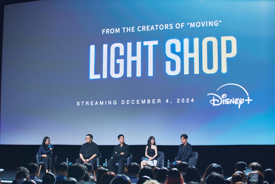 Screenwriter and webtoonist Kang Full, actors Ju Ji-hoon, Park Bo-young and director Kim Hee-won attend a press conference for Disney+'s upcoming series ″Light Shop″ held at Marina Bay Sands in Singapore on Wednesday. [WALT DISNEY COMPANY KOREA]