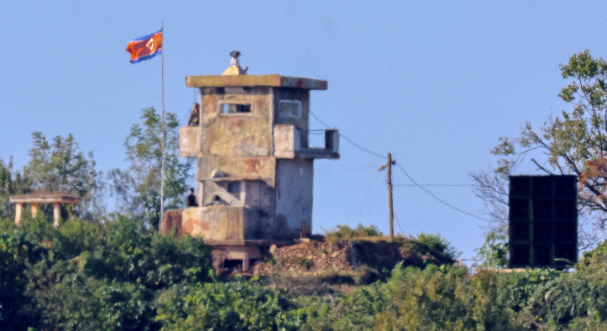 An object that seems to be a loudspeaker appears next to a North Korean military post on the inter-Korean border. [YONHAP] 