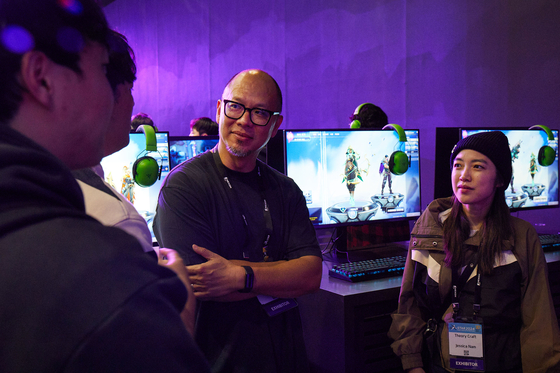 Theorycraft Games CEO Joe Tung and Games Producer Jessica Nam at the Supervive booth during the G-Star gaming festival in Busan on Friday [NEXON] 