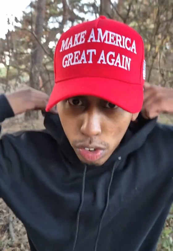 Johnny Somali is seen with a Make America Great Again (MAGA) walking among shrubbery in an Instagram video uploaded on Wednesday. [SCREEN CAPTURE]