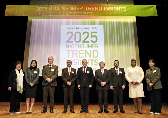 From left, Korea JoongAng Daily Executive Editor Choi Ji-young; Seoul National University research fellow Lee Soo-jin; Tom Ovind, spouse of the Norwegian ambassador; Ambassador of Oman Zakariya Al Saadi; Ambassador of Belarus Andrew Chernetsky; Ambassador of Argentina Dario Celaya; Ammar Maarafi, counsellor at the Embassy of the State of Kuwait; Jacquiline Moraa Kenani, Deputy Head of Mission at the Embassy of Kenya; and Korea JoongAng Daily business reporter Jin Eun-soo pose for a photo at the 2025 Consumer Trend Insights forum, hosted by the Korea JoongAng Daily, at Mapo District, western Seoul, on Thursday. [PARK SANG-MOON]