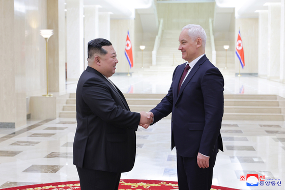 This photo, carried by North Korea's official Korean Central News Agency on Nov. 30, 2024, shows the North's leader Kim Jong-un (L) meeting with Russian Defense Minister Andrei Belousov in Pyongyang the previous day. [YONHAP]