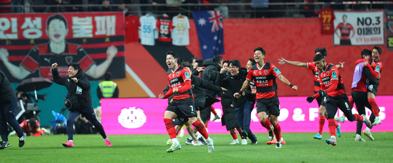 Pohang Steelers players celebrate a goal by Kim In-sung against Ulsan HD FC during the final of the Korea Cup football tournament at Seoul World Cup Stadium in Seoul on Nov. 30, 2024. [YONHAP]