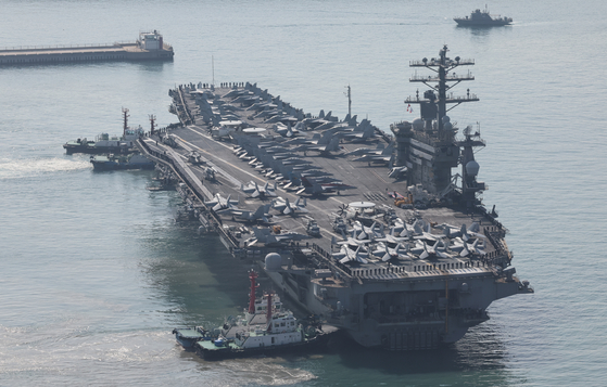The American nuclear-powered aircraft carrier USS Nimitz enters the Busan Korea Fleet Command port on March 28, 2023. [SONG BONG-GEUN]