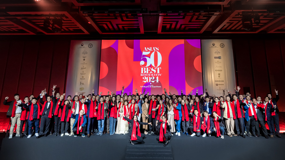 The winners of Asia's 50 Best Restaurants awards pose for photos after the ceremony at Grand InterContinental Seoul Parnas in Gangnam District, southern Seoul, on March 26. [ASIA'S 50 BEST RESTAURANTS] 