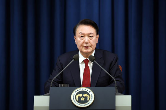 Korean President Yoon Suk Yeol speaks in an unannounced press conference at the Yongsan presidential office in central Seoul Tuesday night. [YONHAP] 
