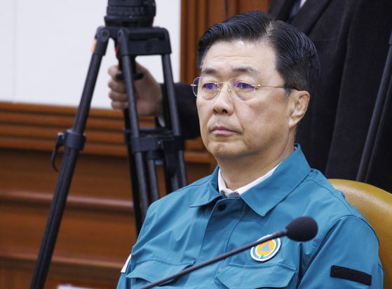 National Intelligence Service (NIS) First Deputy Director Hong Jang-won attends a committee hearing at the Seoul Government Complex on March 14. [YONHAP] 
