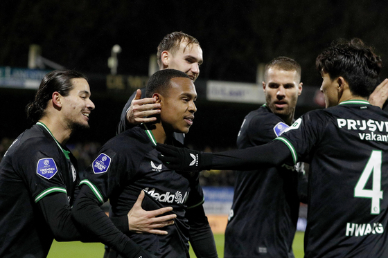 Feyenoord midfielder Hwang In-beom, far right, celebrates with his teammates during an Eredivisie match against RKC Waalwijk at Mandemakers Stadion in the Netherlands on Saturday. [EPA/YONHAP] 