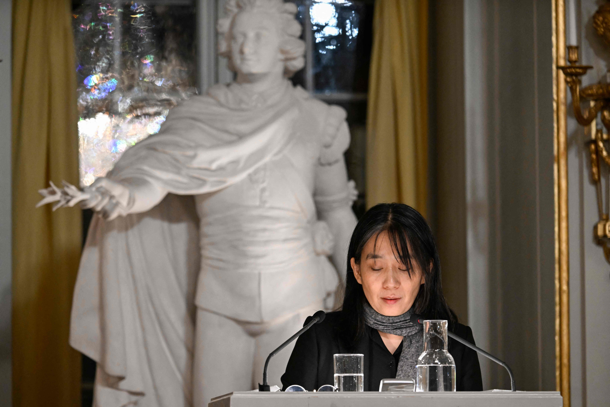  Han Kang speaks during this year's Nobel Prize lecture in literature at the Swedish Academy on Saturday in Stockholm, Sweden. [AFP]