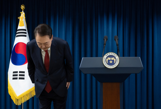 President Yoon Suk Yeol bows after giving a public address at the Yongsan presidential office in central Seoul on Saturday. [PRESIDENTIAL OFFICE] 