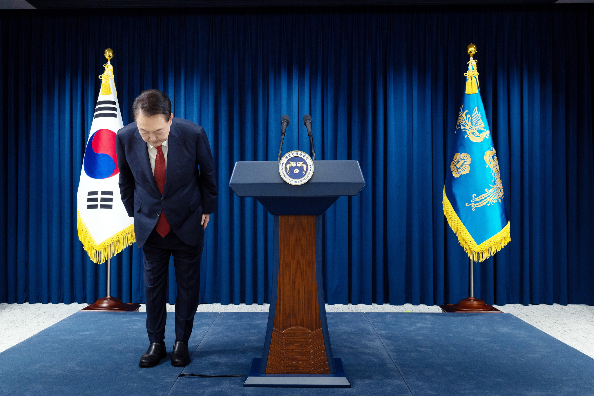 President Yoon Suk Yeol bows in apology during a public address at the presidential office in Yongsan, central Seoul, on Dec. 7, ahead of the National Assembly’s vote on his impeachment motion. [PRESIDENTIAL OFFICE]