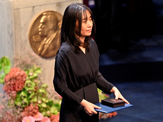 Korea’s first Nobel Prize in Literature laureate, Han Kang, receives her award at the Nobel Prize award ceremony at the Blue Hall of Stockholm City Hall in Sweden on Dec. 10. [REUTERS] 