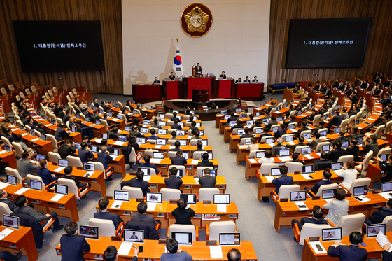 National Assembly Speaker Woo Won-shik declares the second impeachment motion against President Yoon Suk Yeol to have passed, with 204 votes in favor, at the main chamber of the National Assembly in Yeouido, Western Seoul, on Saturday. [NEWS1]