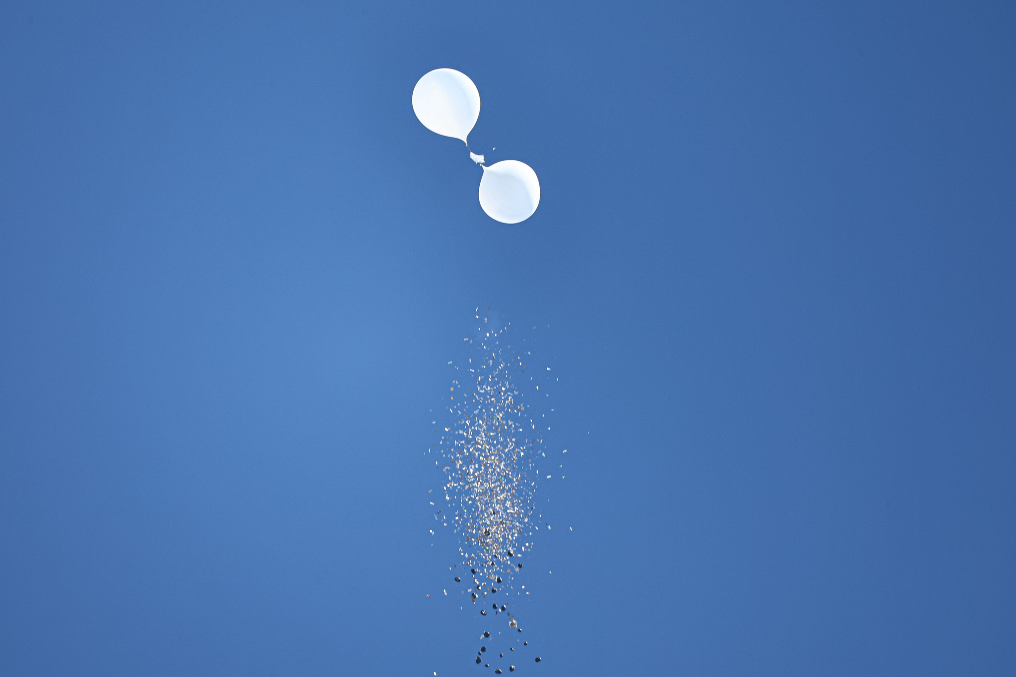 Trash-laden balloons sent by North Korea spill trash over Mapo District, western Seoul, on Oct. 4.